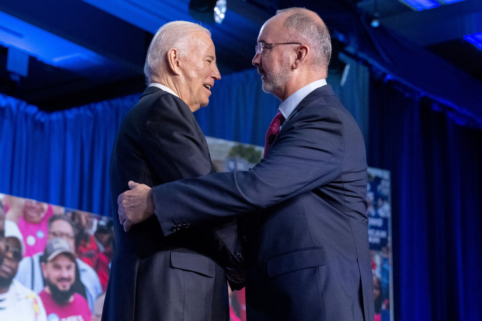 President Biden (l) was praised by United Auto Workers chief Shawn Fain during a conference on Wednesday.