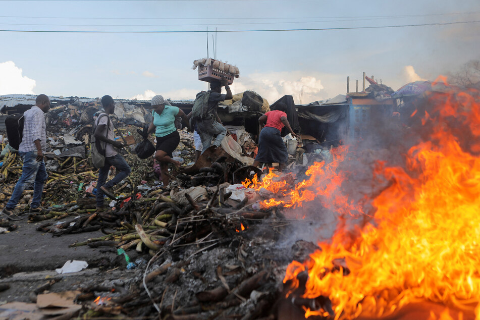 A burning street barricade during a protest against the government and rising fuel prices, in Port-au-Prince, Haiti.