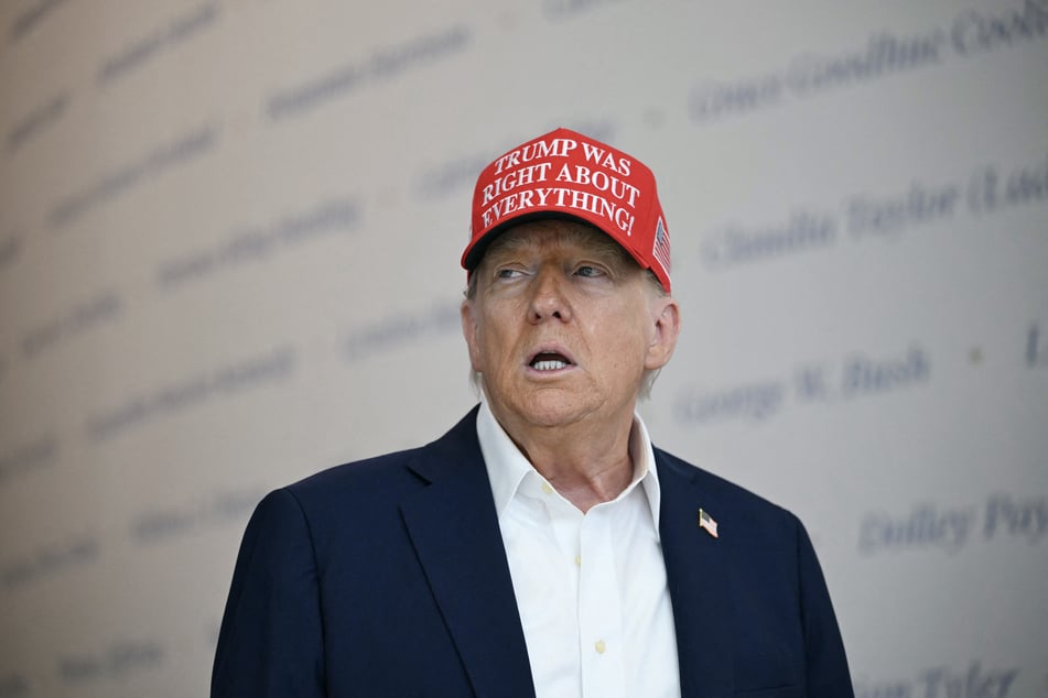 US President Donald Trump speaks at The People's House, a White House immersive experience across the street from the Eisenhower Executive Office Building, during a tour on Friday, in Washington, DC.