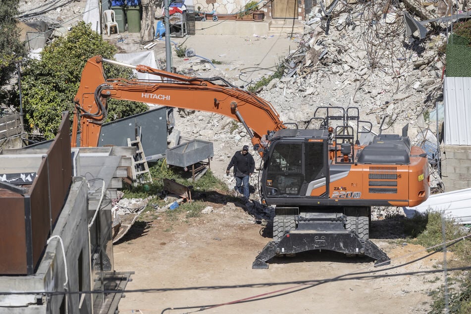 Municipal heavy machinery is seen at the Palestinian neighborhood of Silwan in Israeli-annexed east Jerusalem on April 23, 2026.