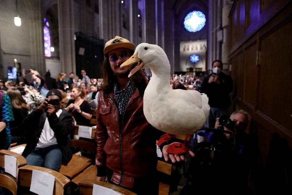 A person holds their pet duck for the Blessing of the Animals during the St. Francis Day Service at the Cathedral of St. John the Divine in New York City on October 1, 2023.