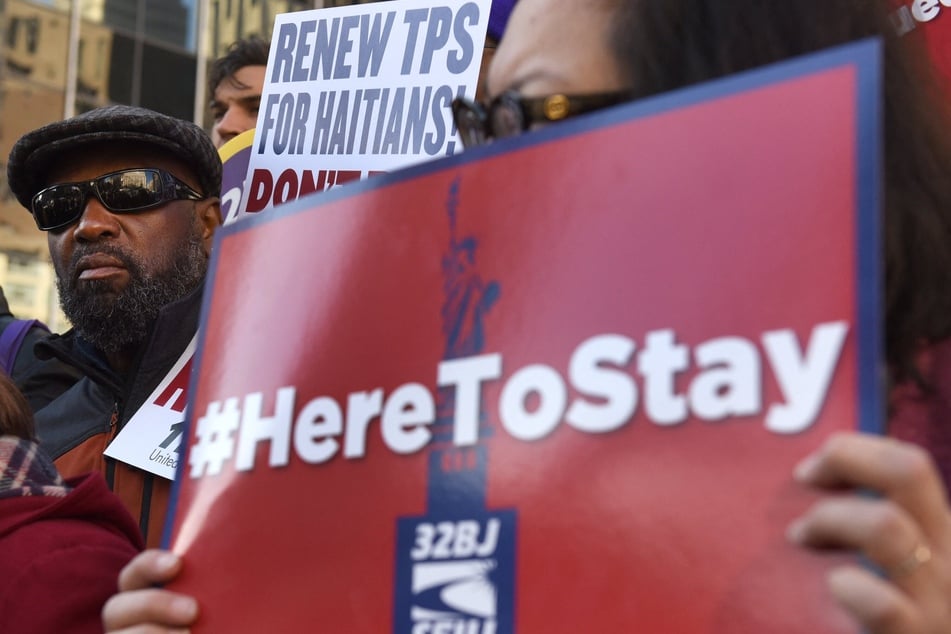 Immigrants' rights advocates rally in support of TPS for Haitians in New York City.
