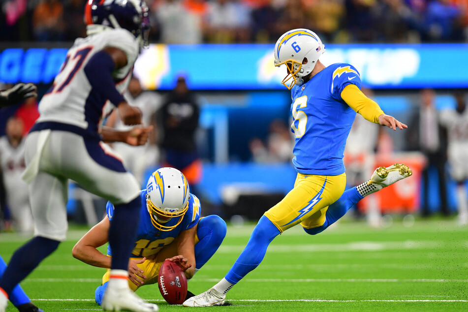 Los Angeles Chargers place kicker Dustin Hopkins kicks the game-winning field goal against the Denver Broncos during overtime at SoFi Stadium.