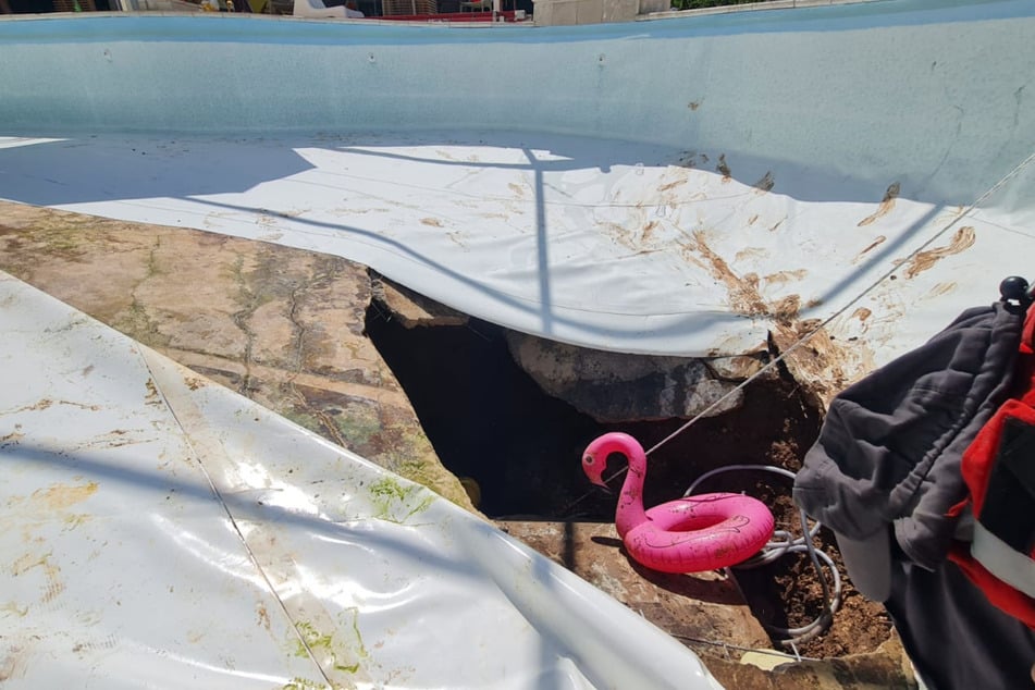 A giant hole ripped open at the bottom of the pool.