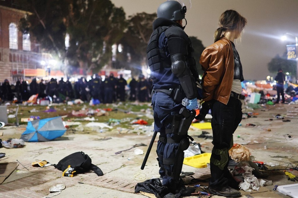 A California Highway Patrol officer detains a protestor while clearing a Gaza solidarity encampment after dispersal orders were given at the University of California, Los Angeles campus in May 2024.