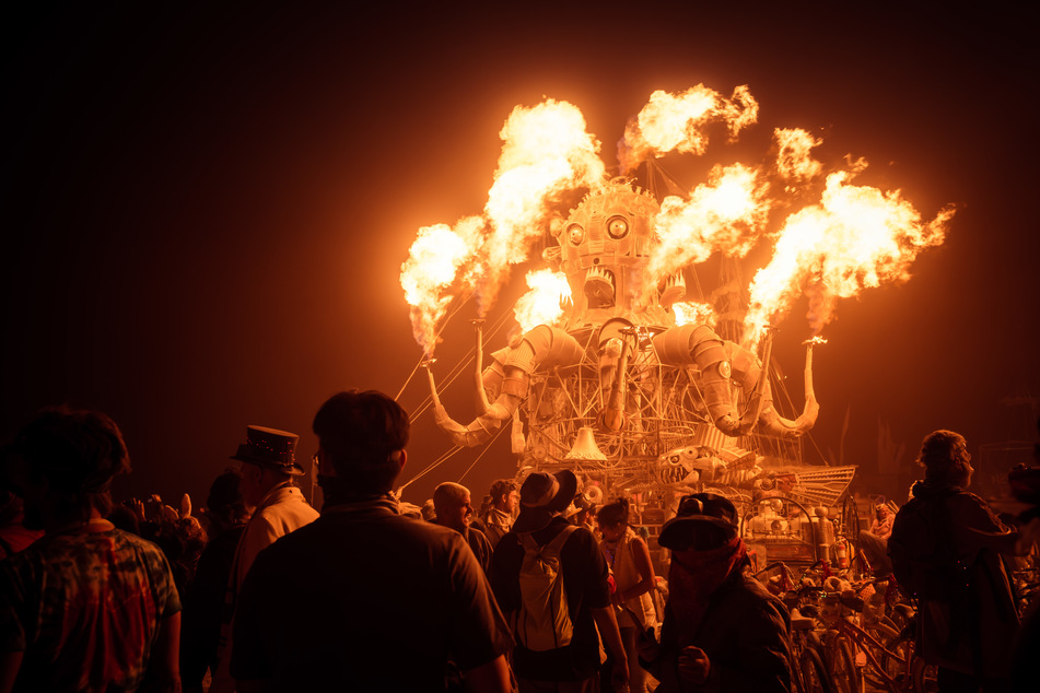 Burning Man culminates on the sixth night in the burning of a large wooden figure in Black Rock Desert (stock image, archive image).