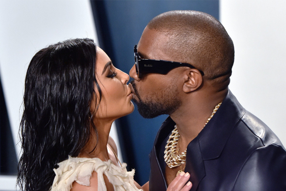 Kim Kardashian (l.) and Kanye West (r.) kept hope alive that their romance could reignite after the couple's showing at the Chicago listening event on Thursday night.