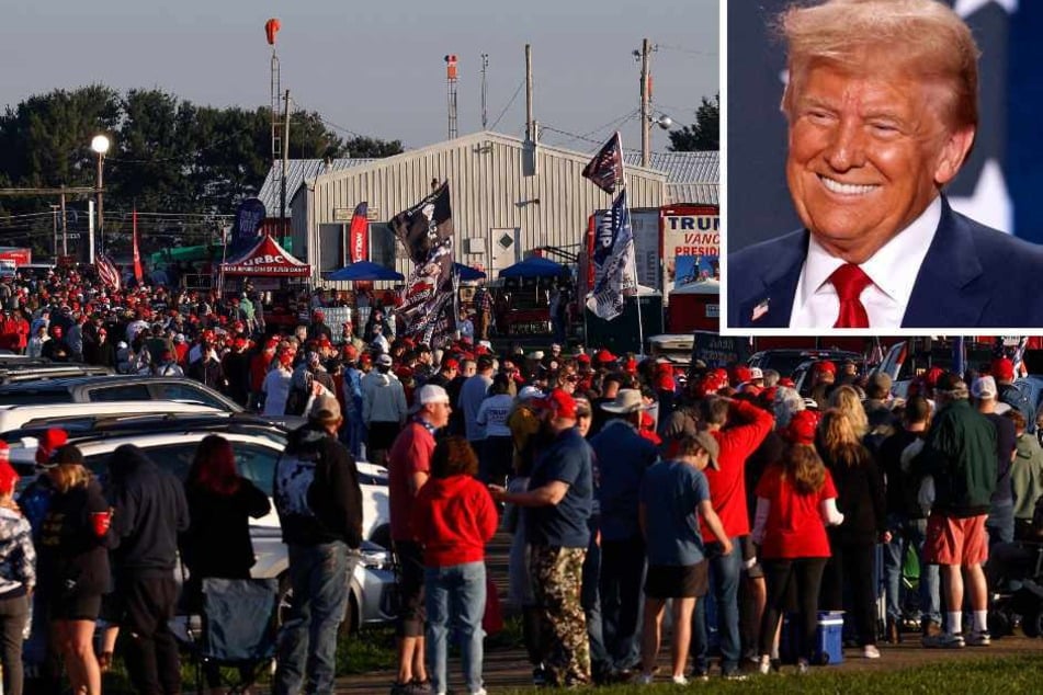 Attendees wait in line prior to a rally by Donald Trump (top r.) at the Butler Farm Show Inc. on Saturday in Butler, Pennsylvania.