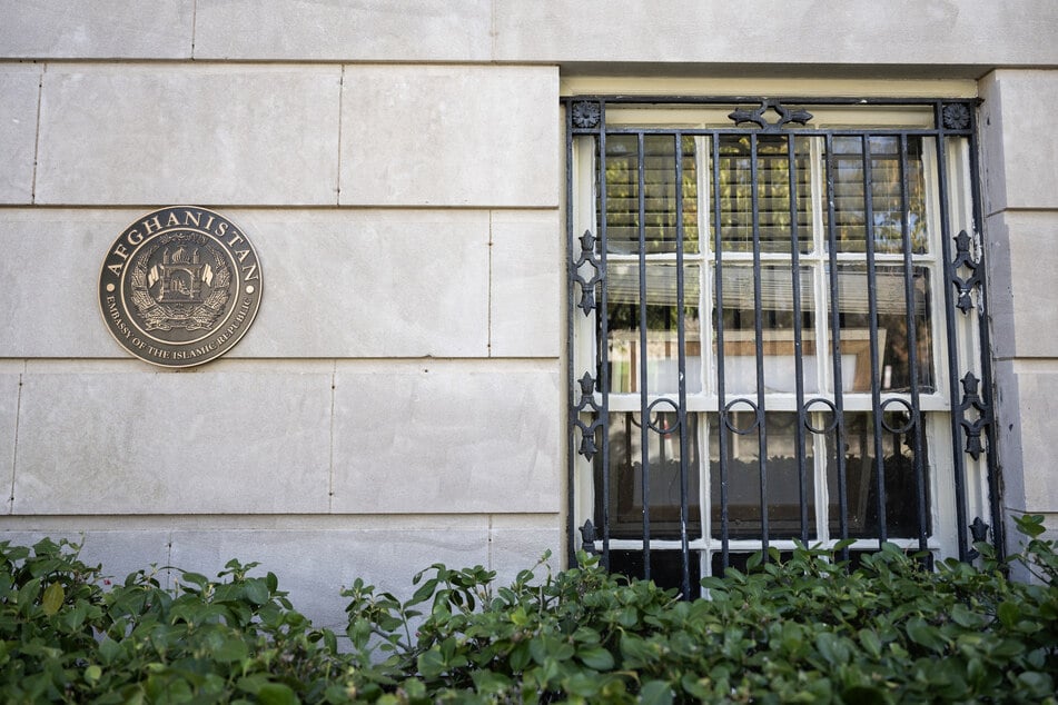 The Afghanistan embassy seal is seen on the outside of the abandoned embassy in Washington, DC on November 14, 2025.