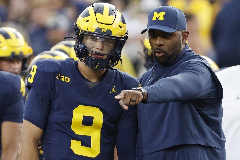 Current offensive coordinator Sherrone Moore (r) is reportedly poised to take over Michigan football as head coach following Jim Harbaugh's exit.