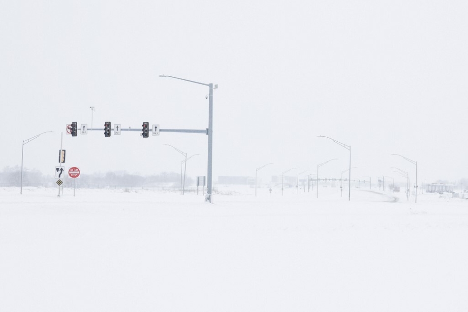 Thick snow covers an intersection in Des Moines, Iowa, on January 9, 2024.