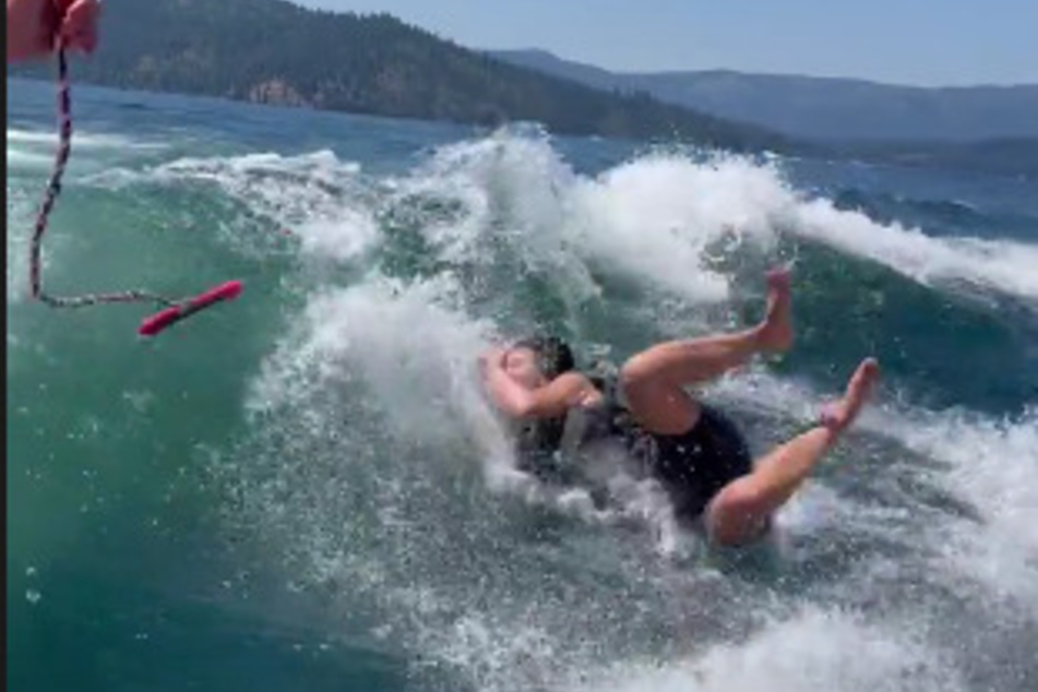 Wipe out! Kim Kardashian falls off her waterboard into the ocean.