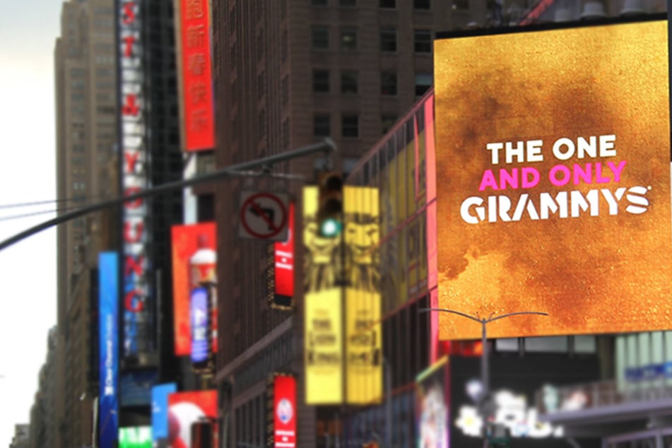 A giant graphic promoting the Grammy Awards appears in Times Square.