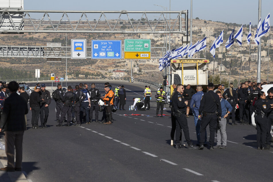 Israeli security forces inspect the scene of a shooting in Jerusalem on Thursday.