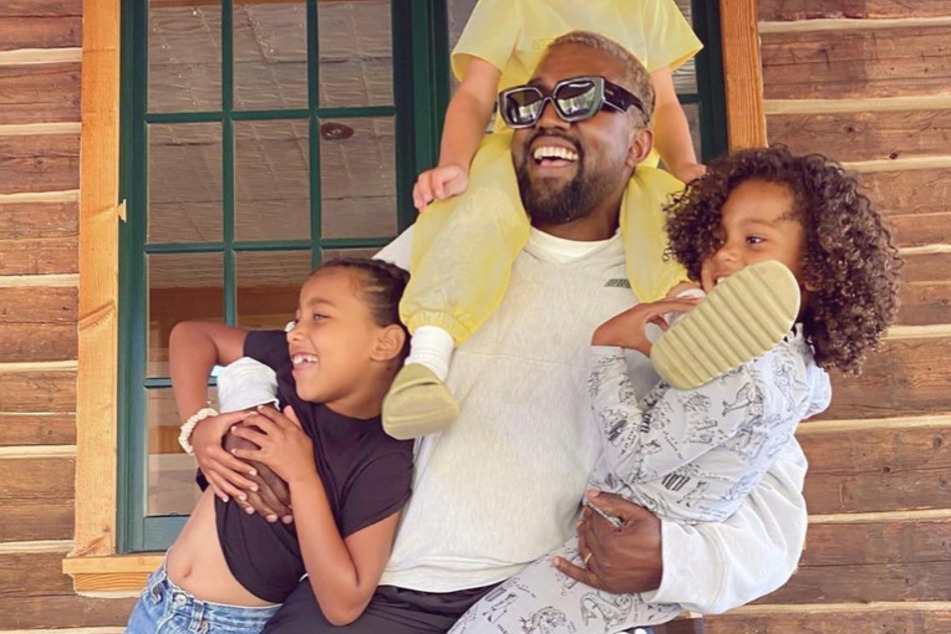 Kim Kardashian revealed that she speaks to a therapist when it comes to parenting advice for her and Kanye West's four kids.