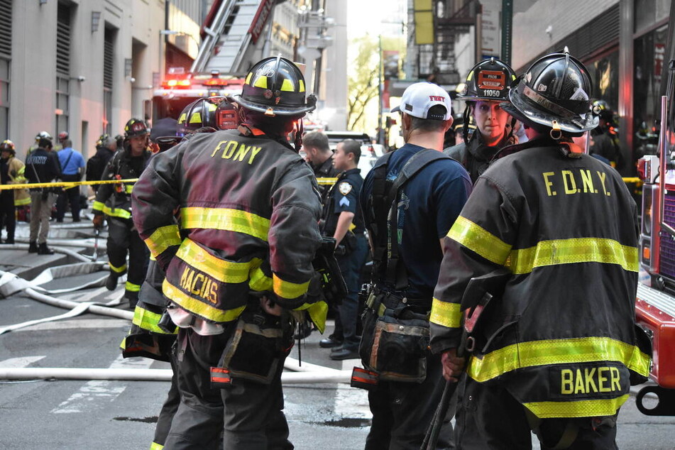 New York City firefighters at the scene of the parking garage collapse on Tuesday in lower Manhattan.
