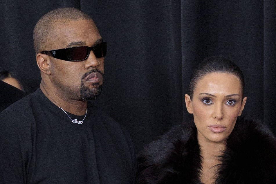 Kanye West is reportedly paying Bianca Censori (r.) to bare all of her goodies in her NSFW 'fits.