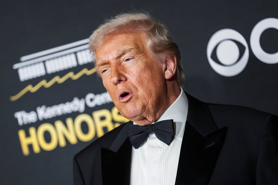 President Donald Trump poses on the red carpet for the 2025 Kennedy Center Honors in Washington DC on December 7, 2025.