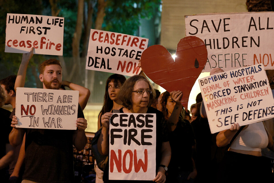 Israeli activists call for a ceasefire in Gaza during a rally in Tel Aviv.