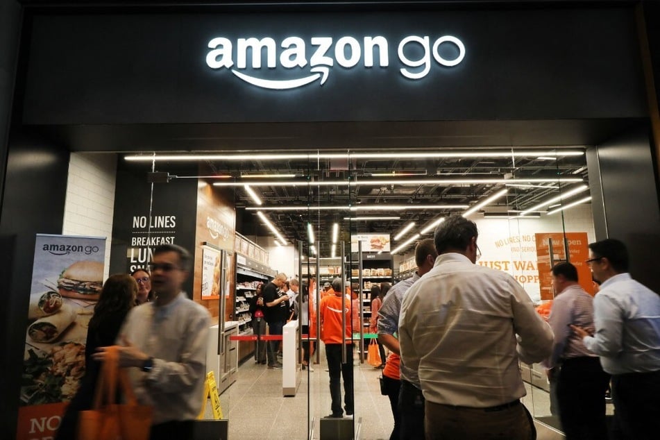People shop at a cashier-less Amazon Go store in New York City.