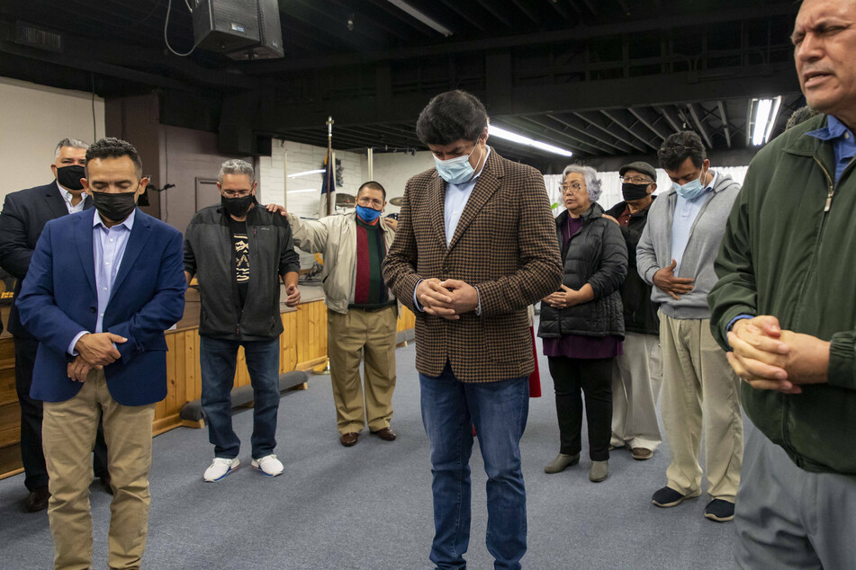 A group of pastors pray together at New Life Family Center Church in Chicago after urging Illinois legislators not to change the parental notification law.