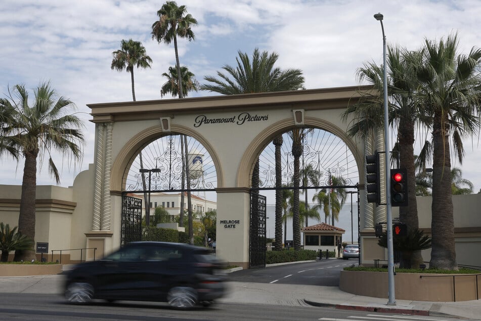 A car drives by the main gate at the Paramount Studios lot on July 13, 2026, in Los Angeles, California.