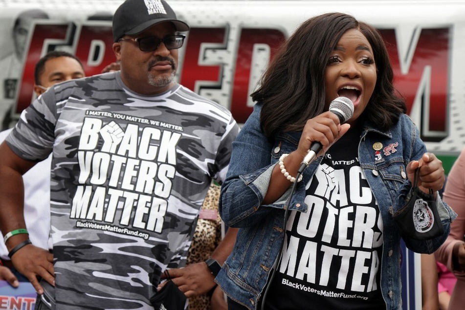 Texas state Rep. Jasmine Crockett, who is in the running to represent Texas' 30th congressional district, speaks at a rally with Black Voters Matter co-founder Cliff Albright.