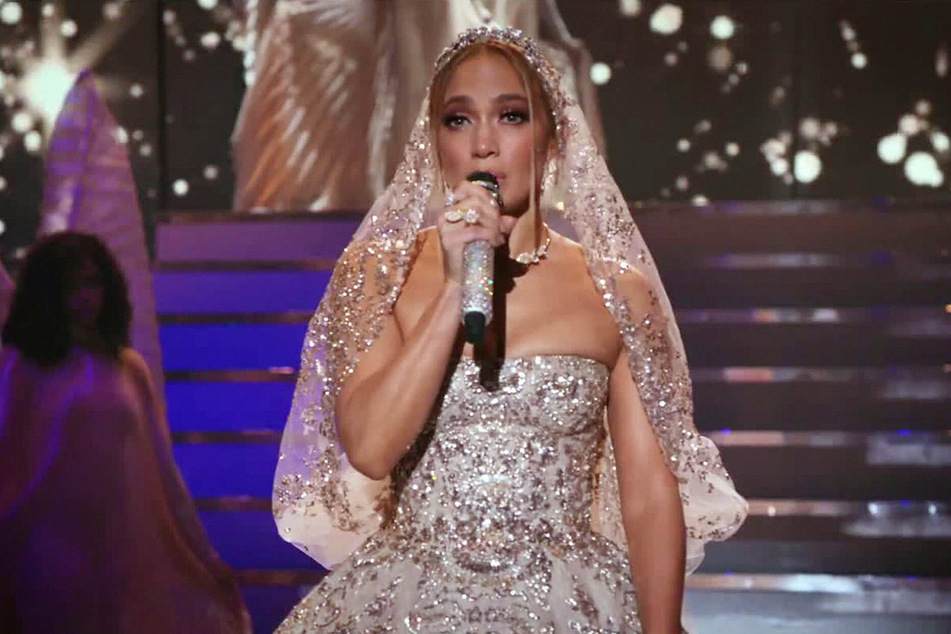 Jennifer Lopez plays a heartbroken singer who agrees to marry a stranger, portrayed by Owen Wilson, in the romantic comedy Marry Me.