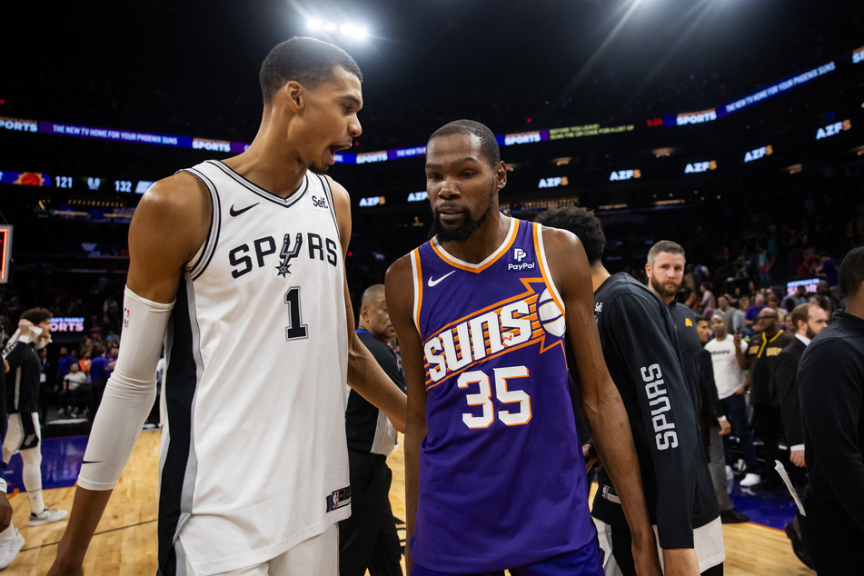 The Phoenix Suns' Kevin Durant (r.) praised Wembanyama's impact and tipped the French star to achieve big things in the game.
