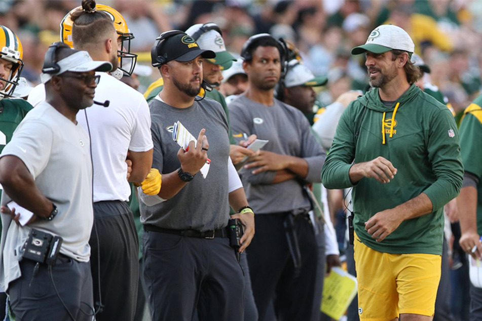 Green Bay Packers quarterback Aaron Rodgers paces the sidelines during a game between the Green Bay Packers and the New York Jets at Lambeau Field on August 21.