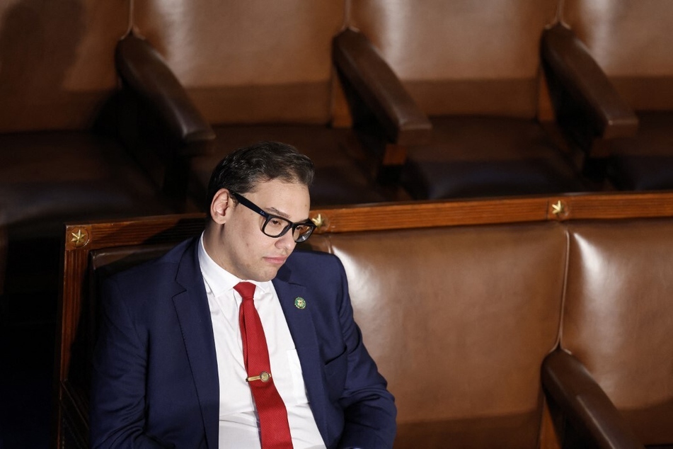 Rep. George Santos listens during proceedings to elect the new Speaker of the House for the 118th Congress.