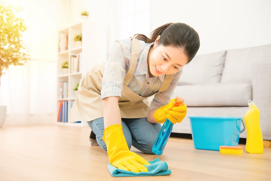 Get stains out of vinyl floors with a combination of light pressure and a good cleaning agent.