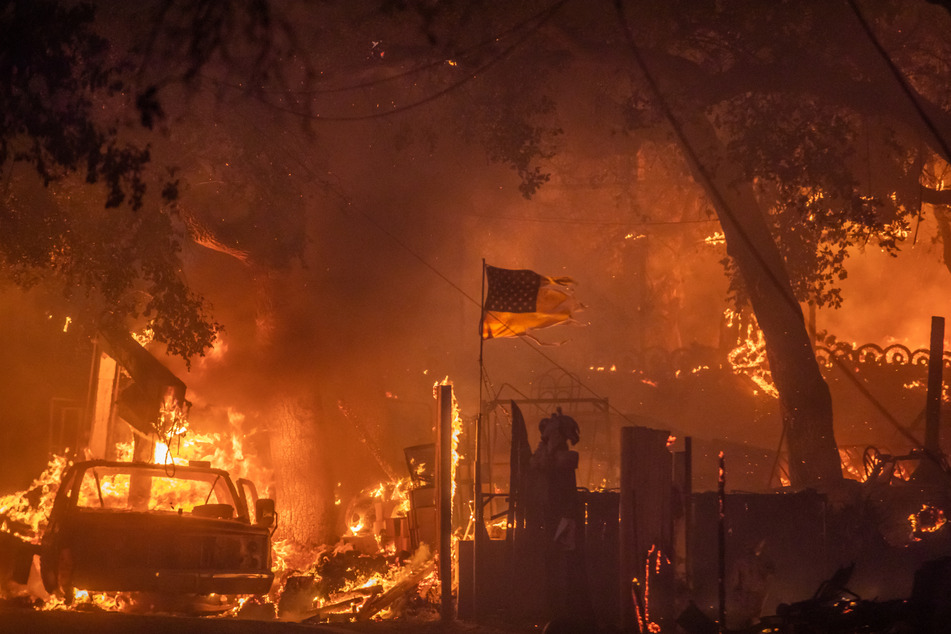 Los Angeles wildfires explode and engulf homes as arson suspect is arrested