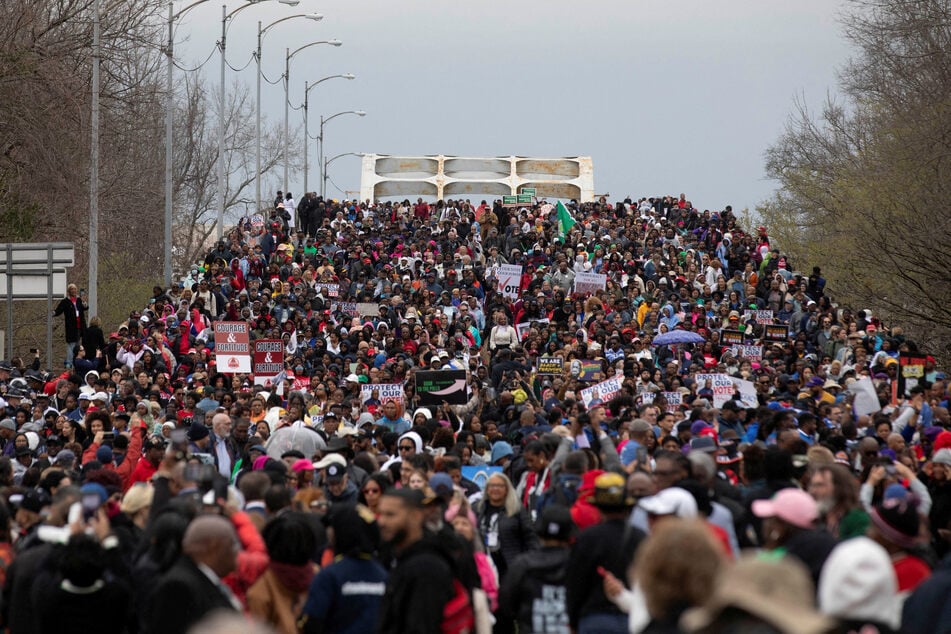 Demonstrators march across the Edmund Pettus Bridge to commemorate the 60th anniversary of "Bloody Sunday" in Selma, Alabama, on March 9, 2025.