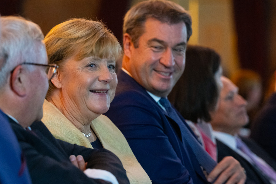 Angela Merkel (68, CDU, frühere Bundeskanzlerin, und Markus Söder (55, CSU), Ministerpräsident von Bayern, nehmen am Festakt teil.