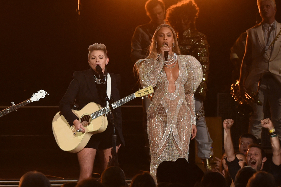 Fans believe that reactions to Beyoncé's (r.) performance at the 2016 Country Music Awards inspired her to create Cowboy Carter.