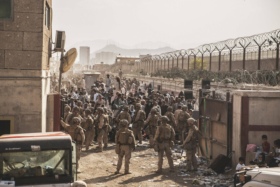 Hamid Karzai International Airport in Kabul has been overwhelmed by thousands of people fleeing the Taliban.