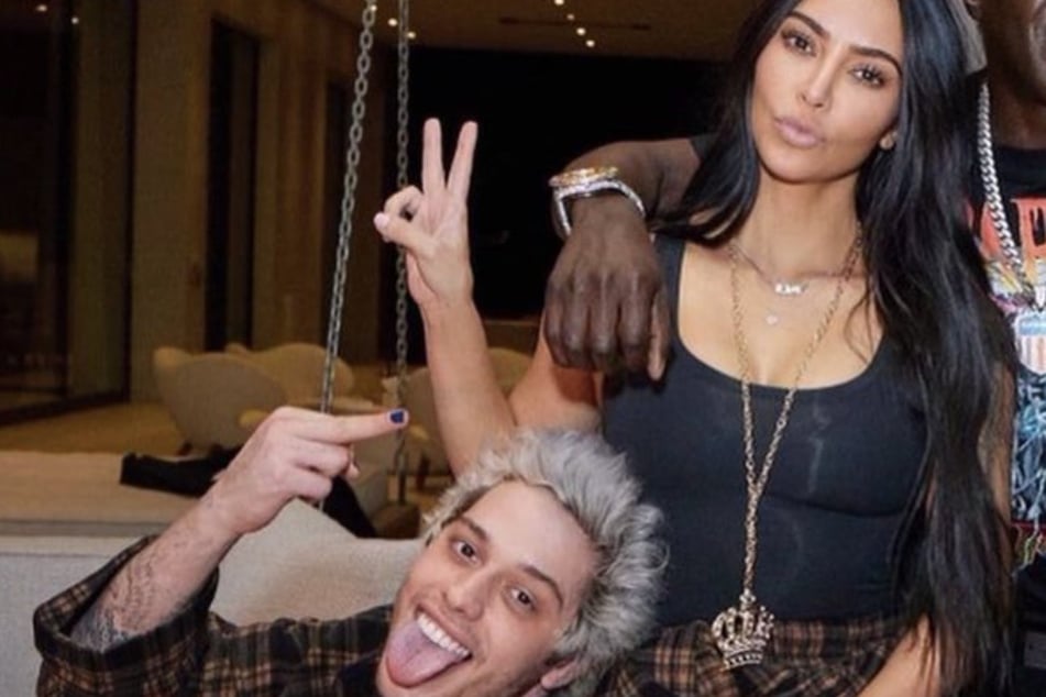 Kim Kardashian and Pete Davidson pose in matching pj's for the comedian's 28th birthday party, which was held at Kris Jenner's mansion.