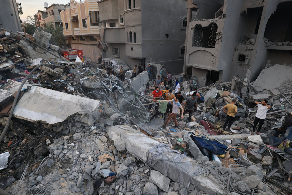 Palestinians searched for survivors in the rubble of a building in the Nuseirat refugee camp in the central Gaza Strip on Tuesday.