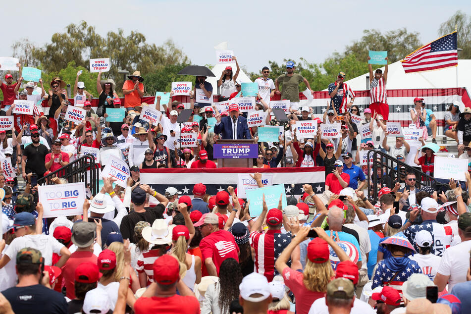 Thousands turned up at Trump's campaign event despite the sweltering heat, which caused one person to collapse.