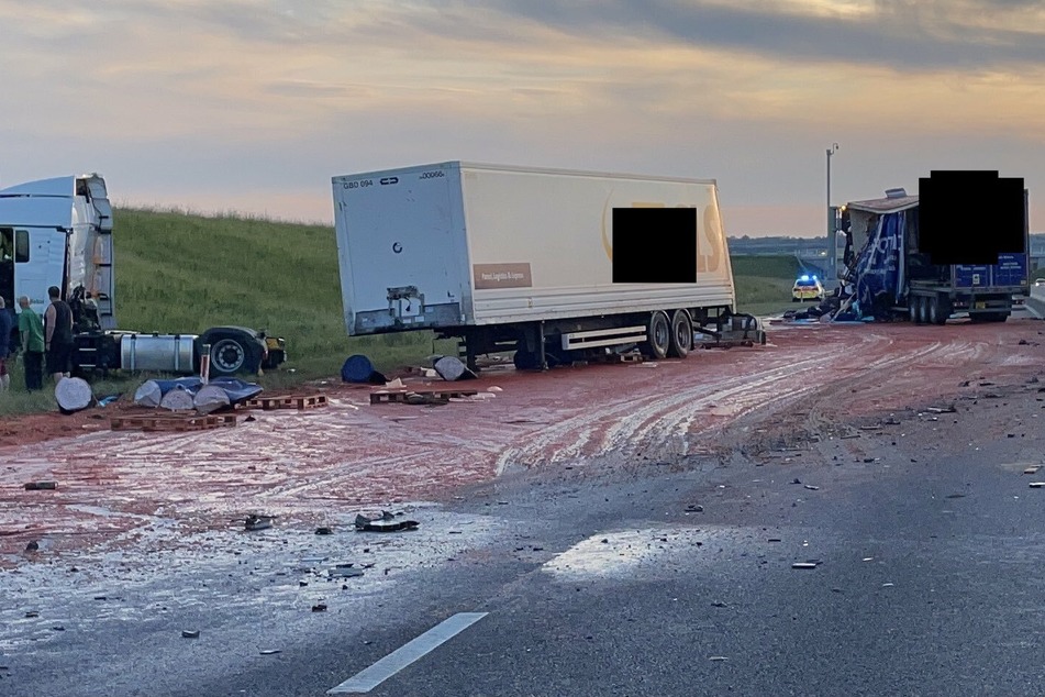 The A14 near Godmanchester closed after two trucks crashed, leaving countless tomatoes and oil littering the highway.