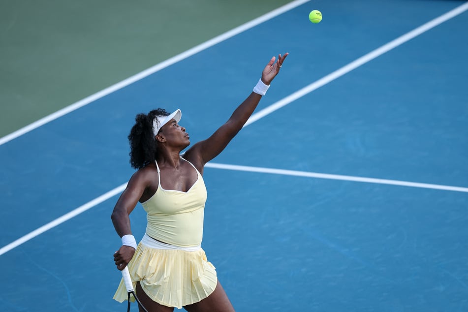 Venus Williams serves during a women's doubles match on day 1 of the Mubadala Citi DC Open 2025.