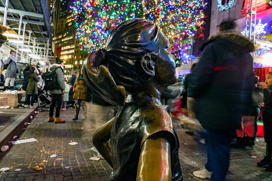 Fearless Girl stands watch in front of the NY Stock Exchange.