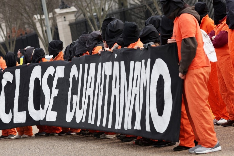 Protesters call for the closure of the Guantanamo Bay detention facility outside the White House.