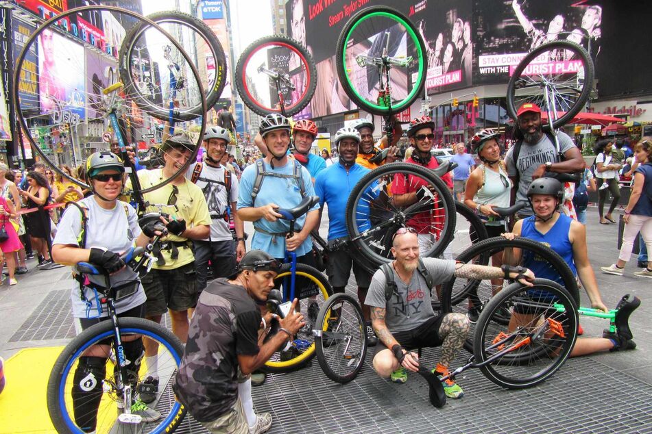A posse of Unicycle Fest merrymakers out and about in Times Square.