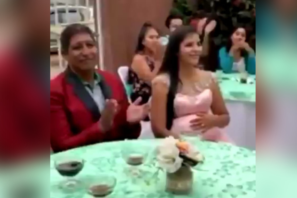 The mother-to-be and her father are expecting to hear a toast.