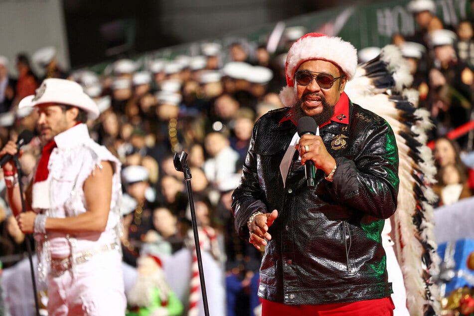 Victor Willis (r.) of Village People performs during the 91st anniversary of the Hollywood Christmas Parade on November 26, 2023.
