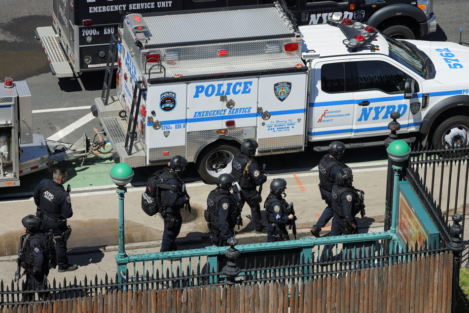 NYPD officers outside the 36th Street station in Brooklyn, New York on Tuesday.