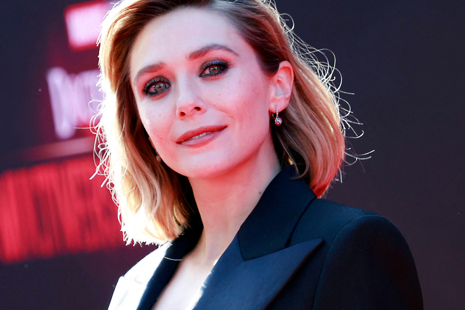 Elizabeth Olsen poses for photos at the Doctor Strange in the Multiverse of Madness premiere in May 2022.