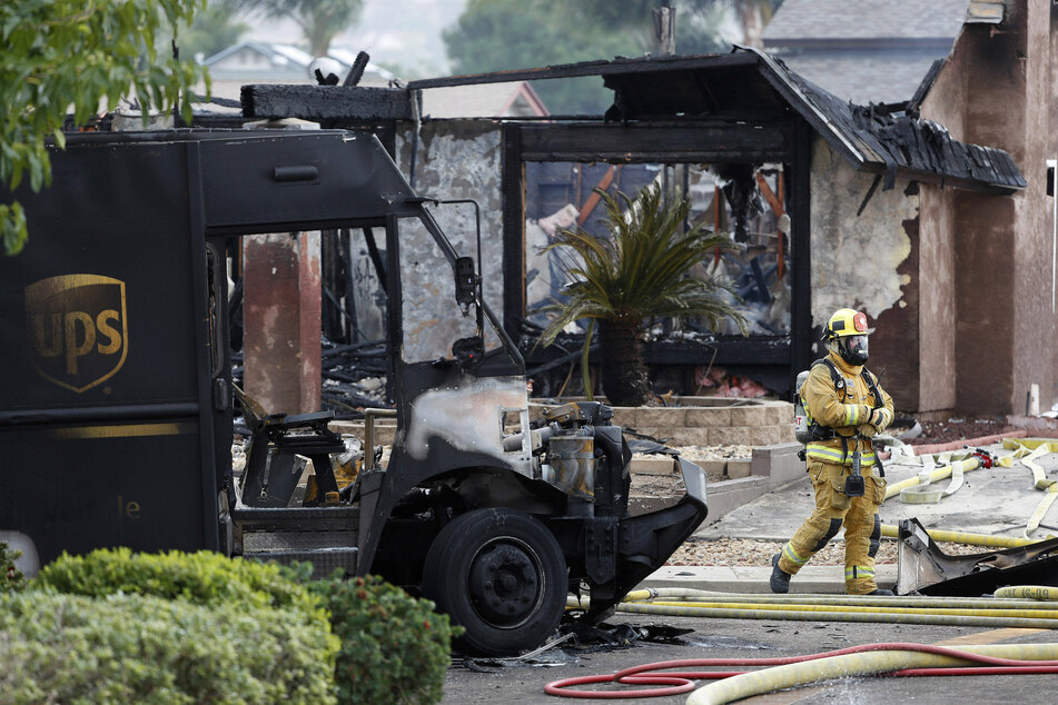 Two people, including a UPS delivery driver, died and two homes were destroyed in the plane crash.